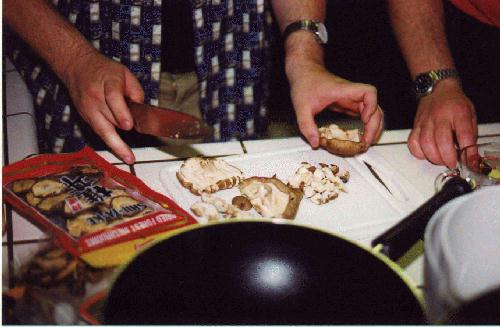 Chris' hands chopping mushrooms