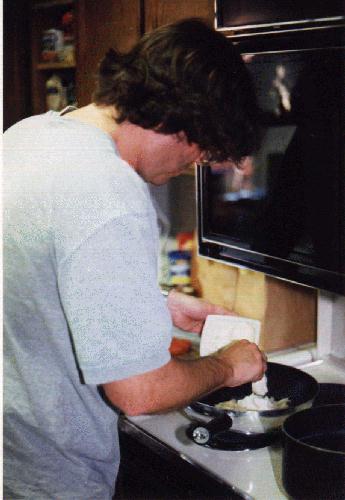 Doug putting mascarpone on pasta