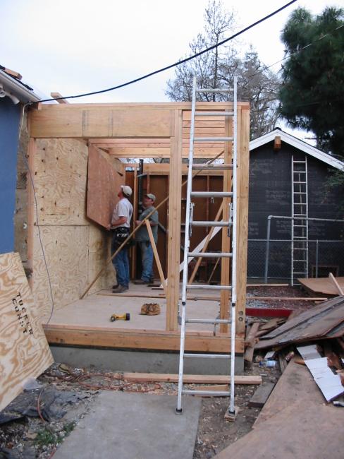 guys putting the covering plywood over the exposed bits