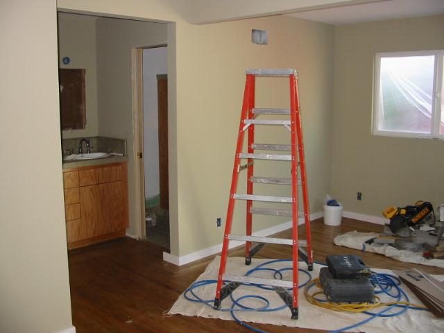 Orange ladder and dropcloth