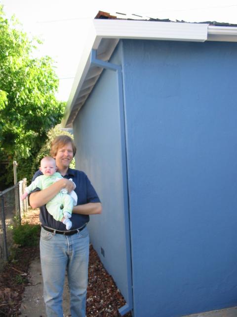 Vernon and Cielo at the side of the house