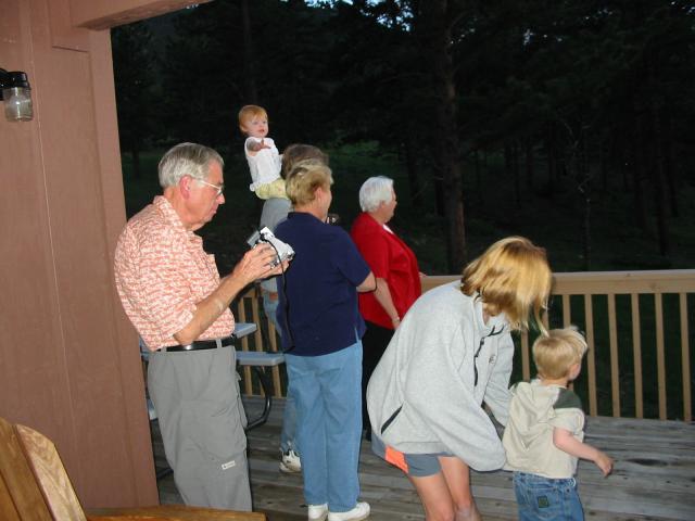 Everyone peers out into the woods