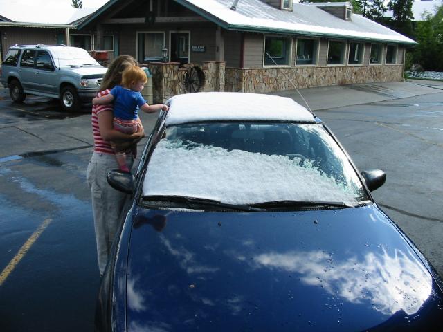 Alison and Cielo look at the car